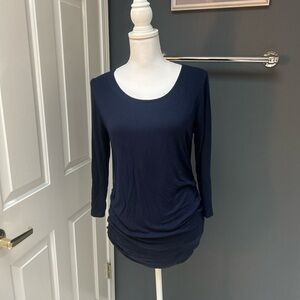Navy Blue Boutique Top crochet details on back.